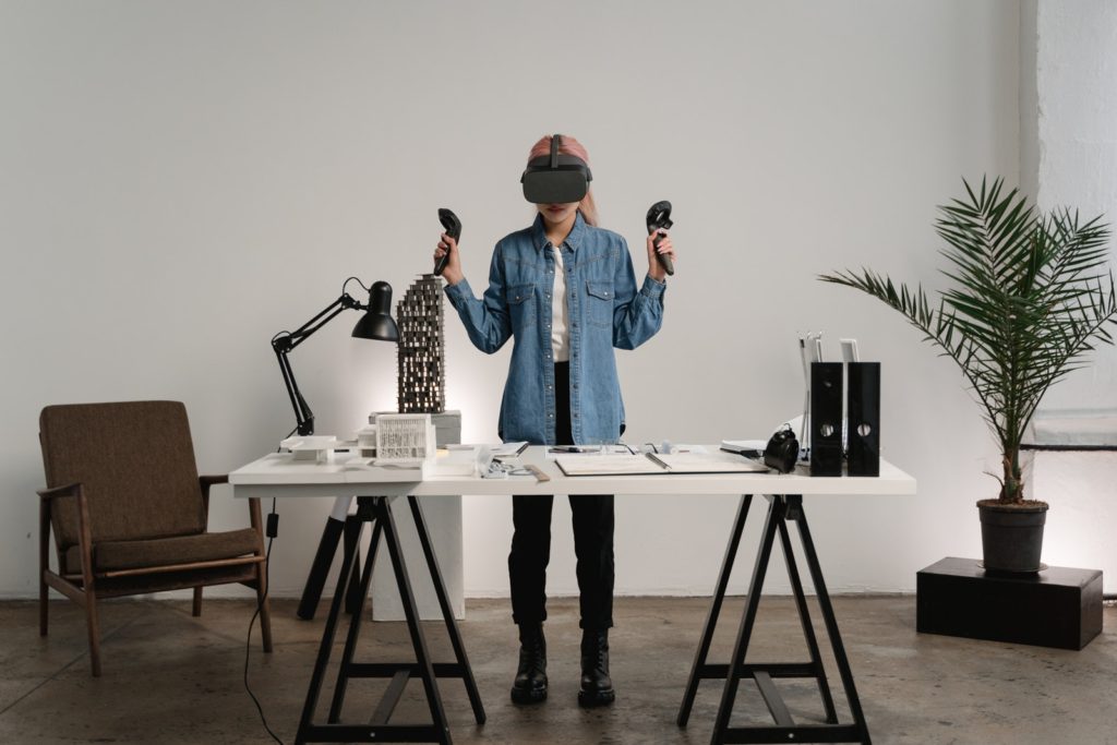 A Woman Wearing a Virtual Reality Gear at Work