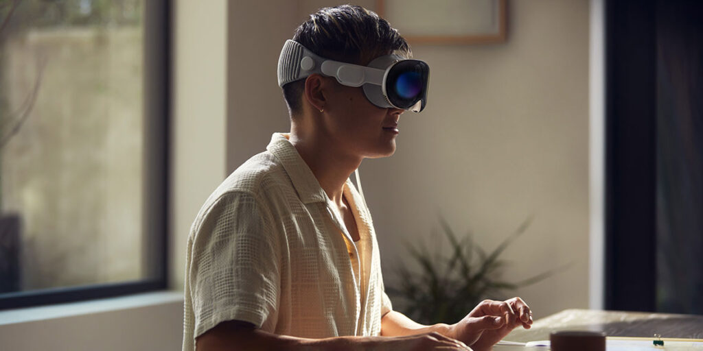Man wearing the new Apple Vision Pro headset.