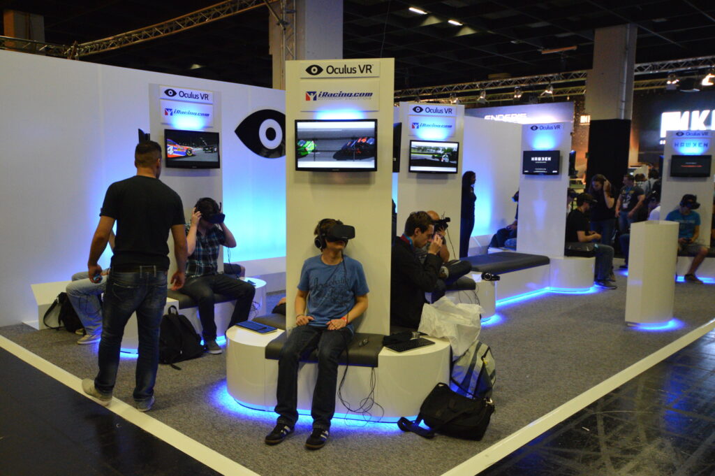 Conference attendees trying out the newest Oculus VR Demos.